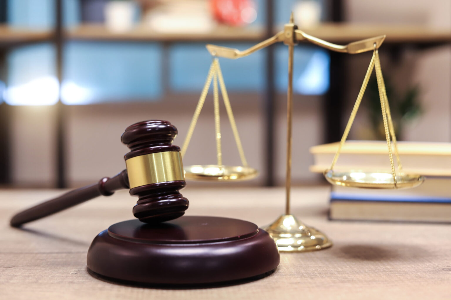 A gavel sits in front of legal scales